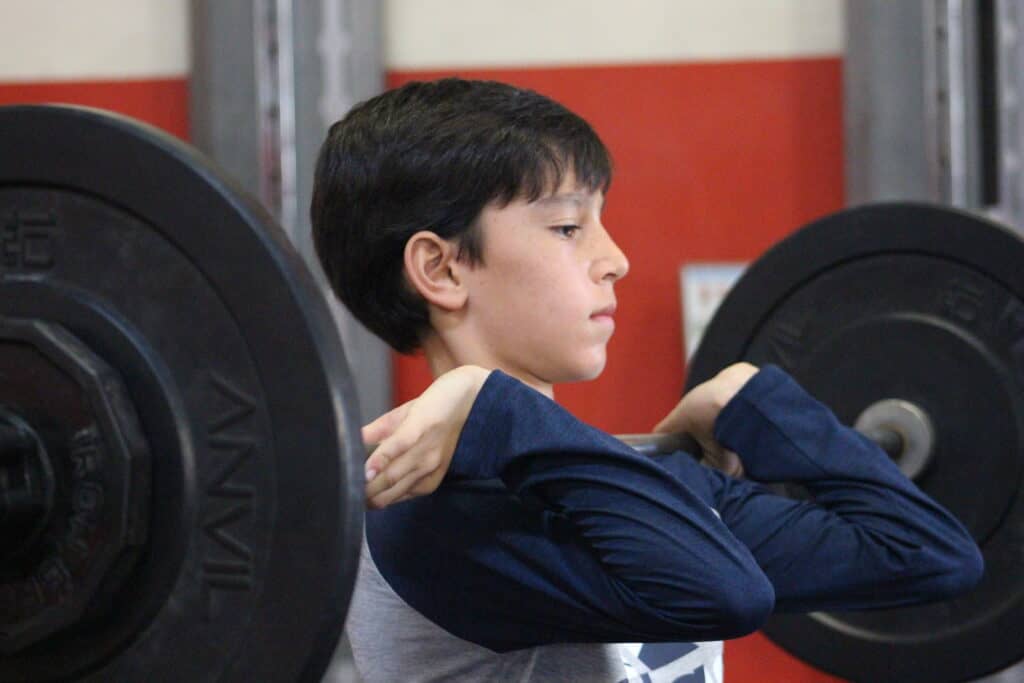 Young Hockey Player Lifting Weights